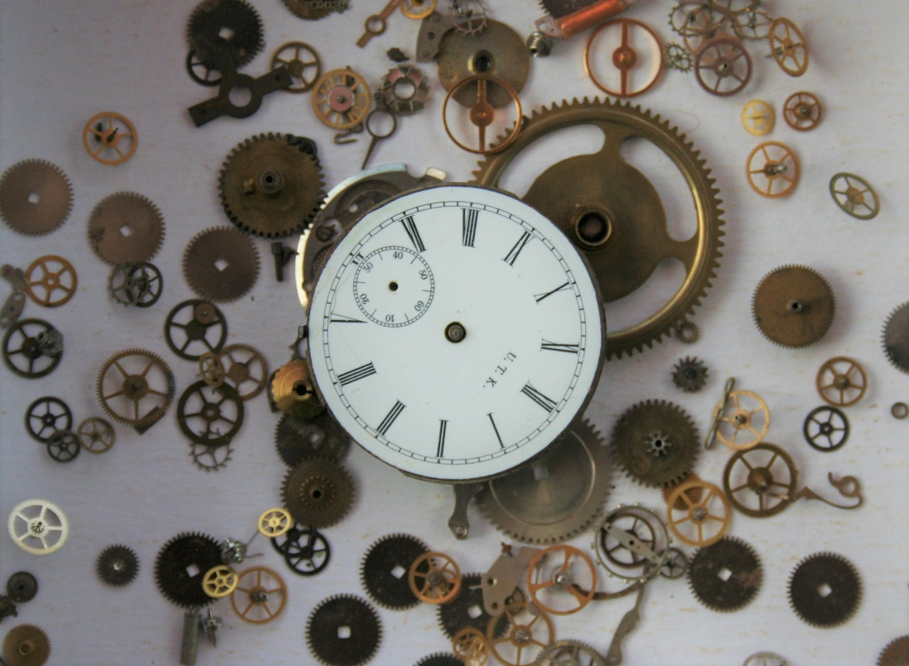 silver and white round analog wall clock
